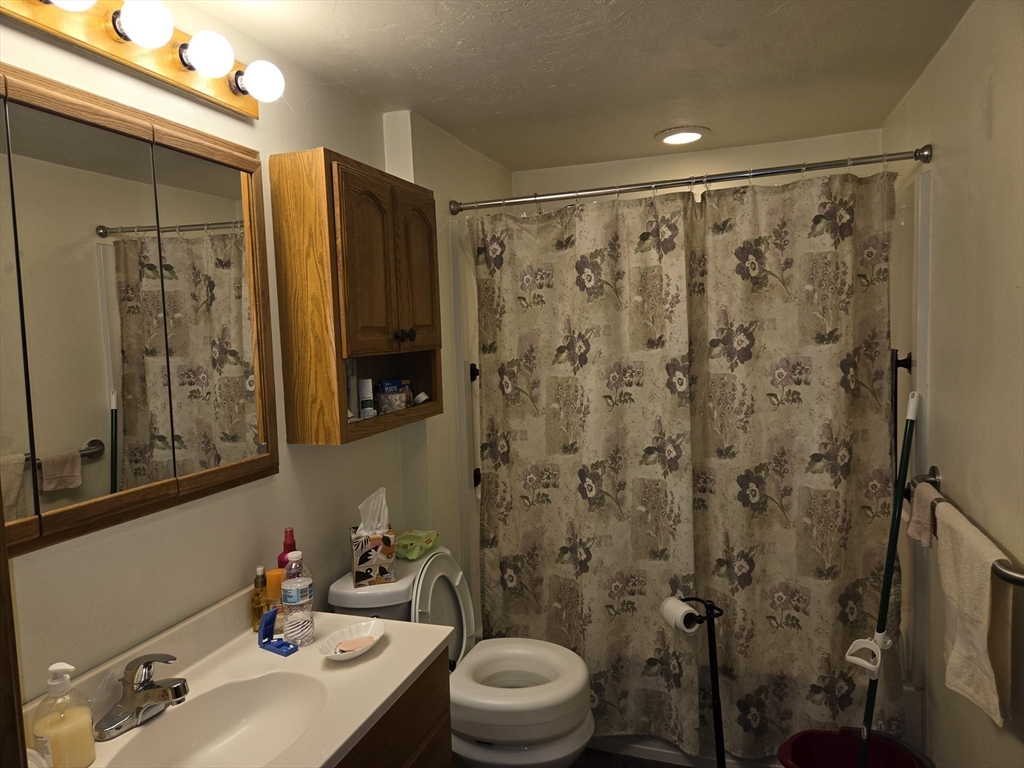 18 Fairview Avenue Dudley, MA 01571 - Photo 13 of 19 a bathroom with a sink toilet and shower