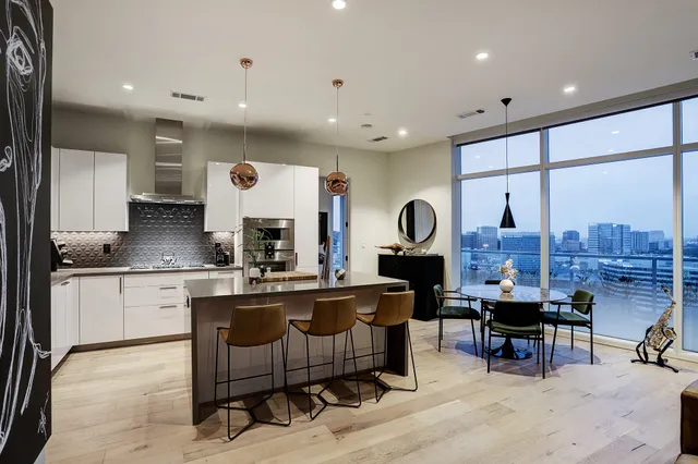 a living room with furniture a window and a fireplace