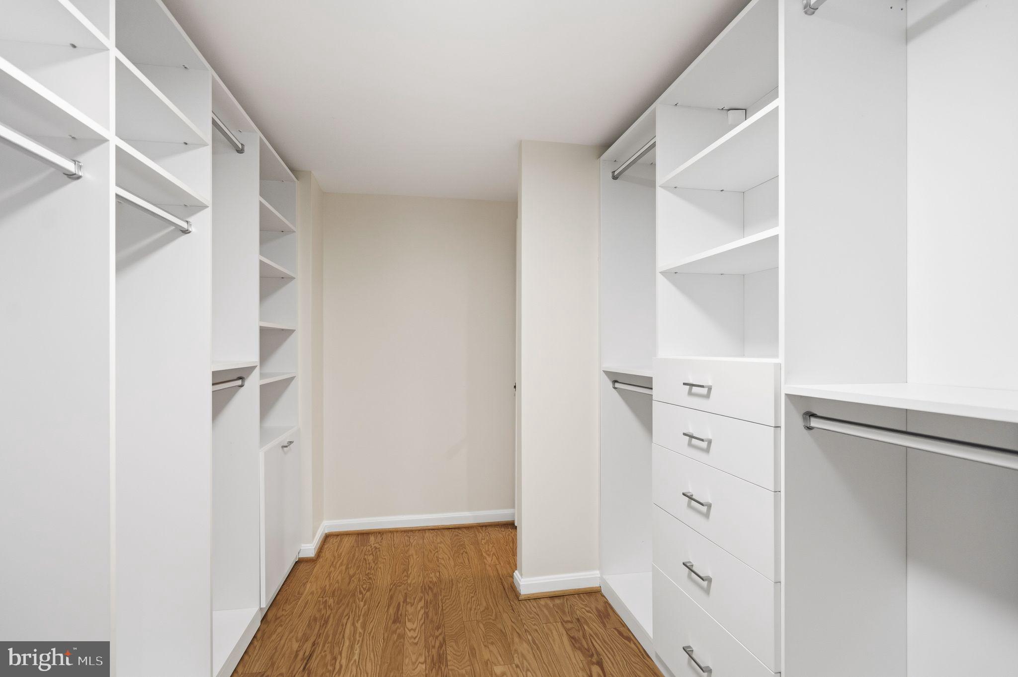 3225 Grace Street Northwest, Unit 226 Washington, DC 20007 - Photo 22 of 45 a view of walk in closet with wooden floor