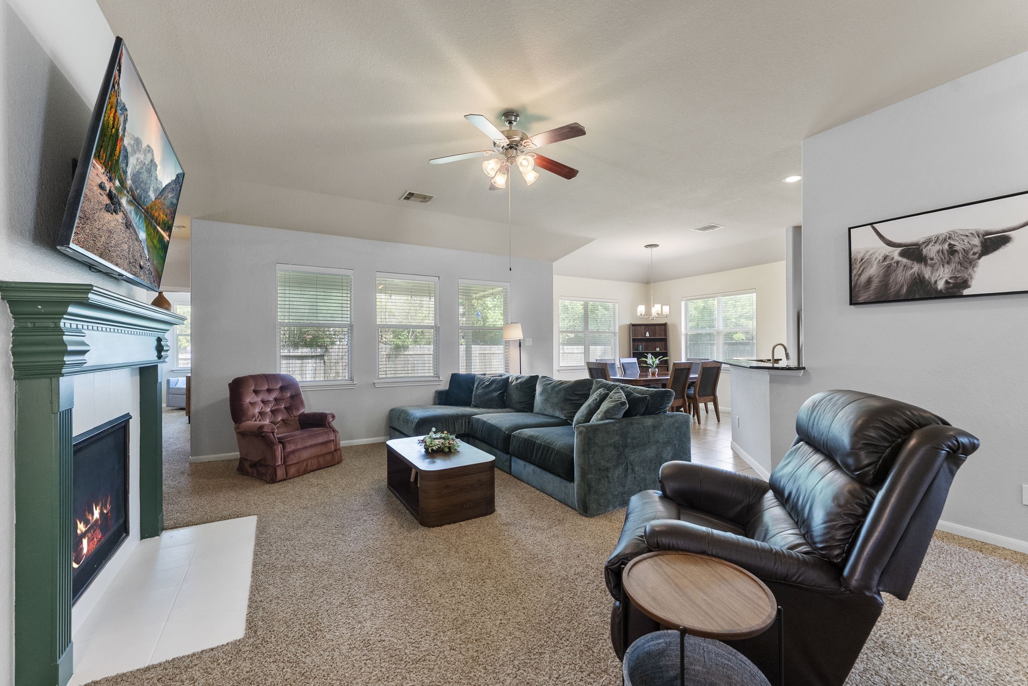 174 Maple Grove Drive Conroe, TX 77384 - Photo 26 of 26 The open floorplan seamlessly connects the living, dining, and kitchen areas.