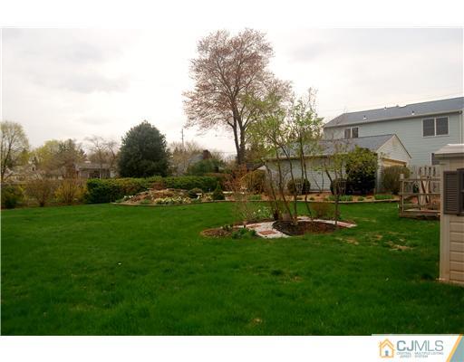 119 Wilson Road Somerset, NJ 08873 - Photo 22 of 25 a view of a garden with a slide