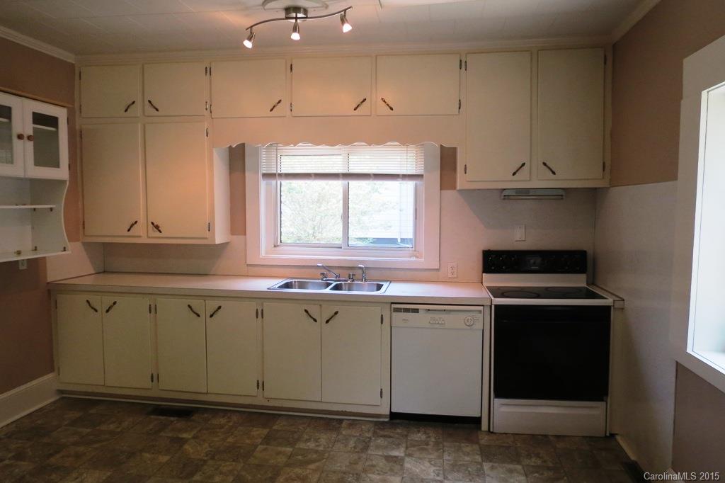207 Rogers Lake Road Kannapolis, NC 28081 - Photo 13 of 21 a kitchen with a sink stove and cabinets