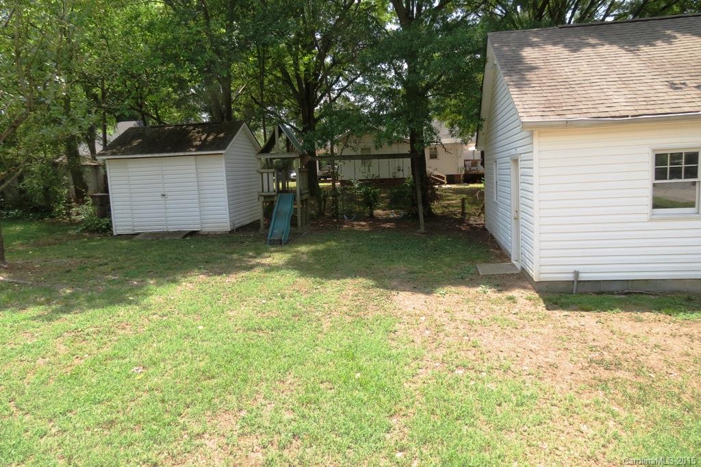 207 Rogers Lake Road Kannapolis, NC 28081 - Photo 5 of 21 a view of a backyard with a tree