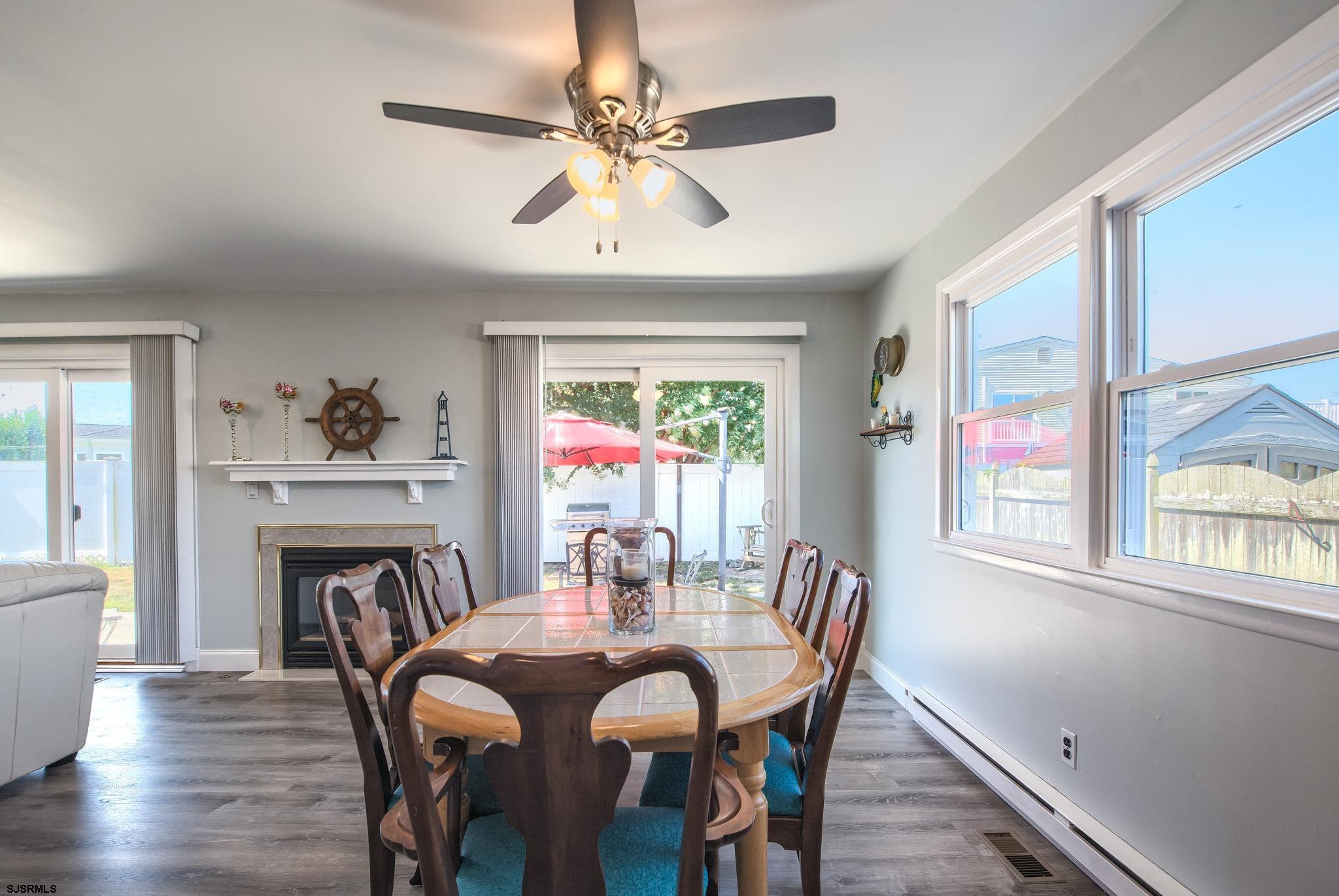 2 Surf Lane Brigantine, NJ 08203 - Photo 12 of 42 a view of a dining room with furniture window and wooden floor