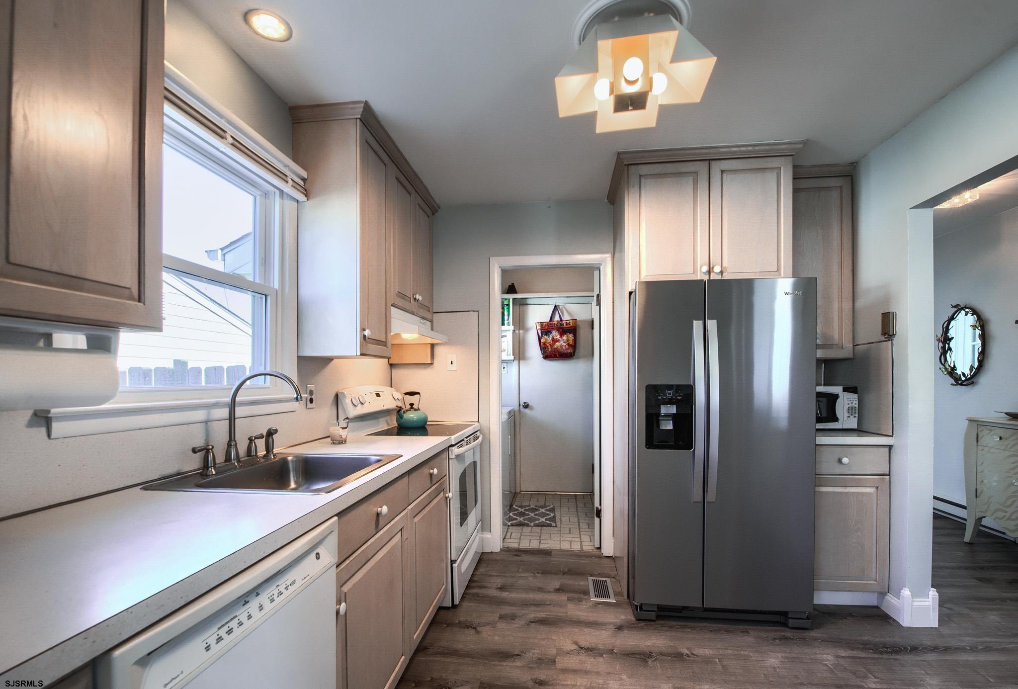 2 Surf Lane Brigantine, NJ 08203 - Photo 14 of 42 a kitchen with a refrigerator and a sink