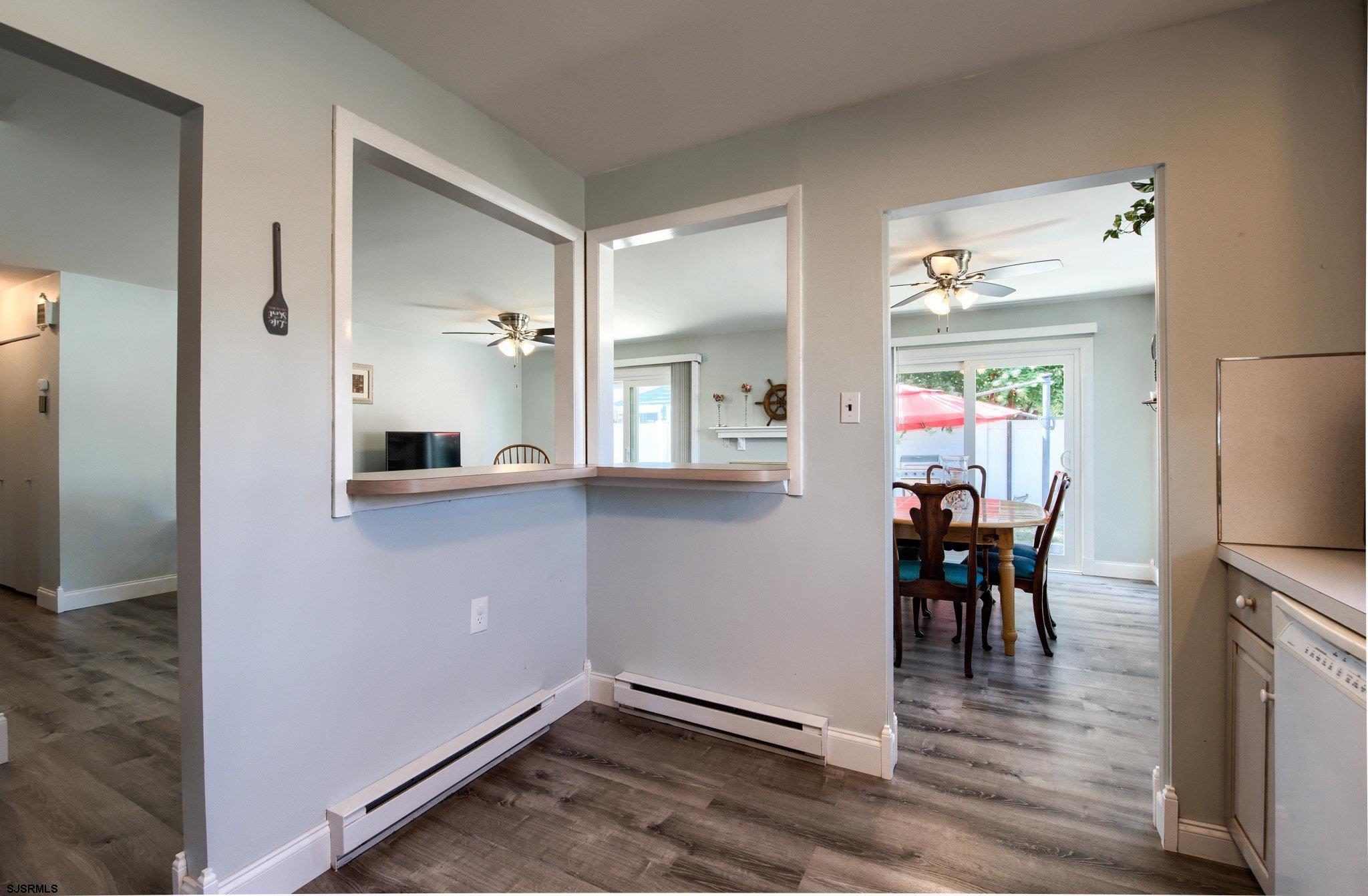 2 Surf Lane Brigantine, NJ 08203 - Photo 16 of 42 wooden floor and dining room with furniture