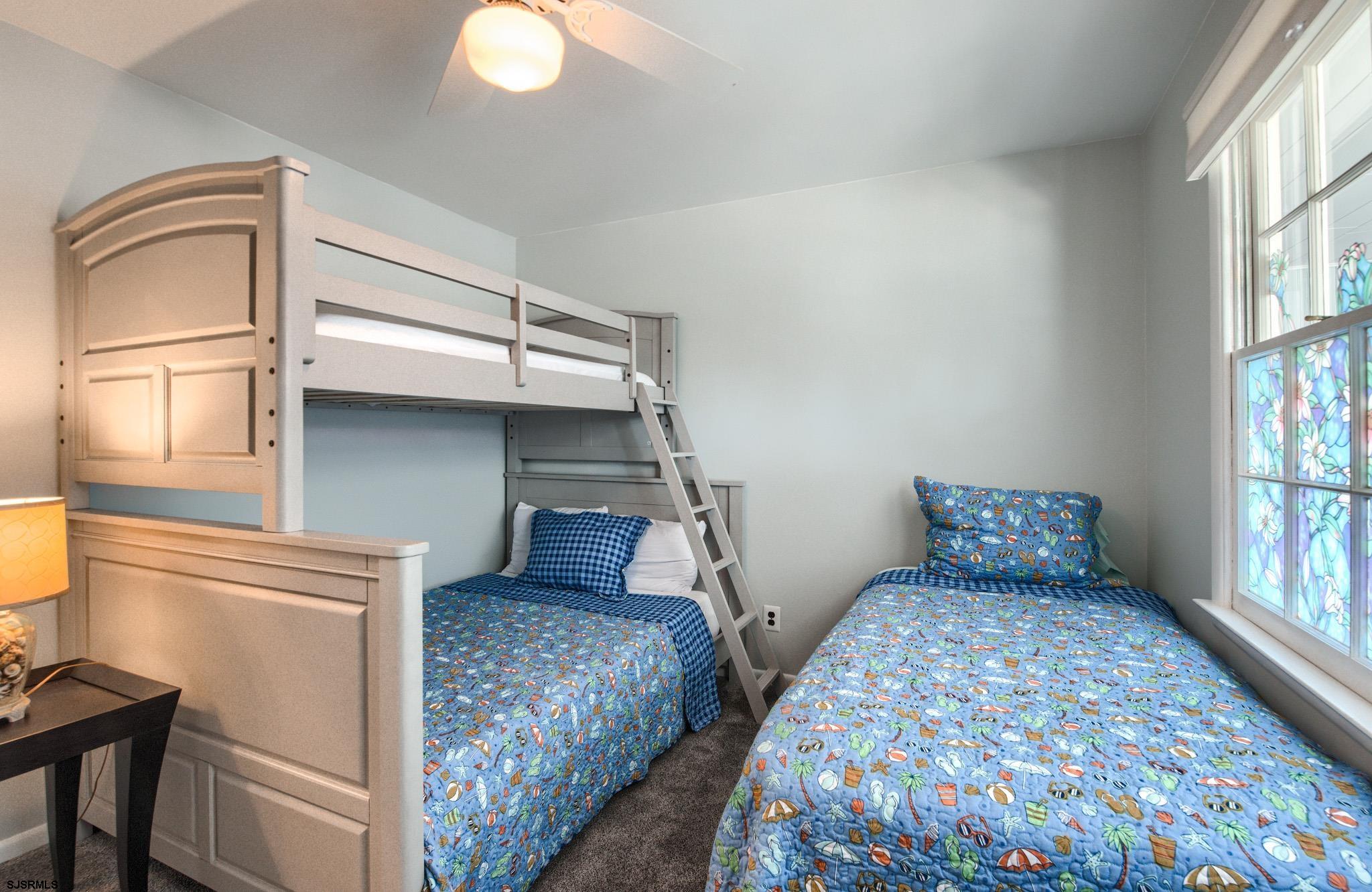 2 Surf Lane Brigantine, NJ 08203 - Photo 26 of 42 a bedroom with two beds and a window