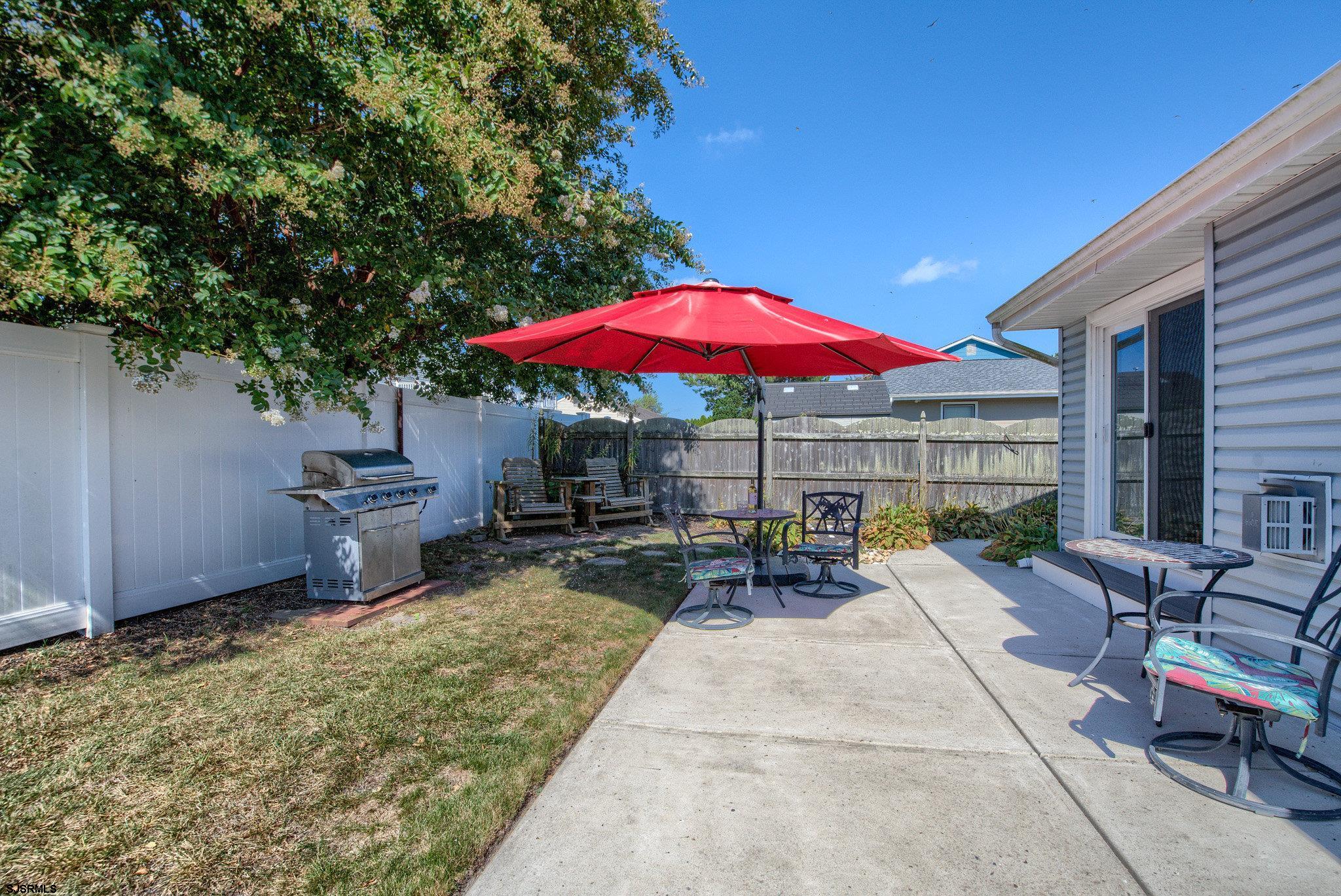 2 Surf Lane Brigantine, NJ 08203 - Photo 28 of 42 a view of a backyard with chairs and a patio
