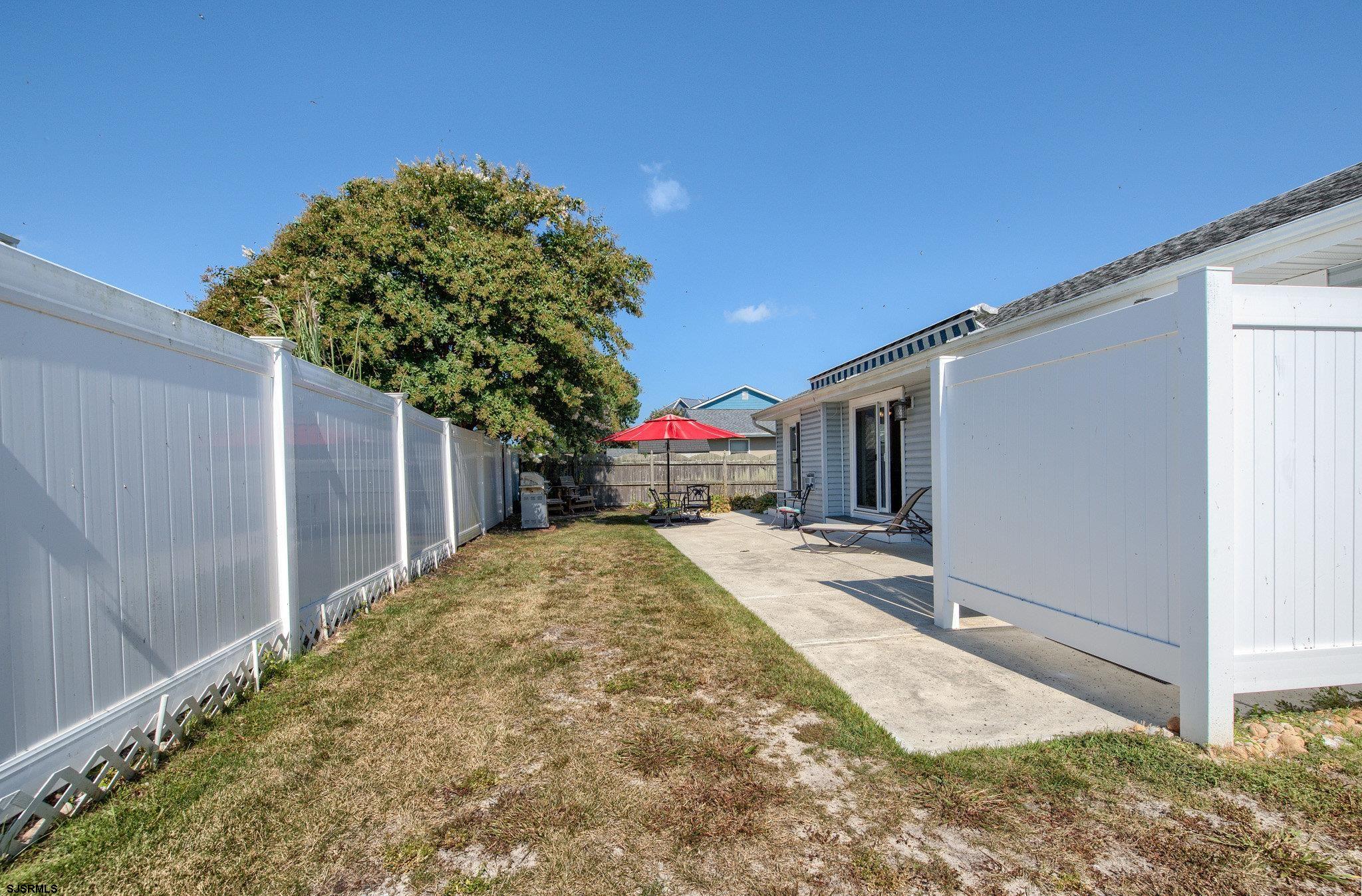 2 Surf Lane Brigantine, NJ 08203 - Photo 29 of 42 a house view with a backyard space