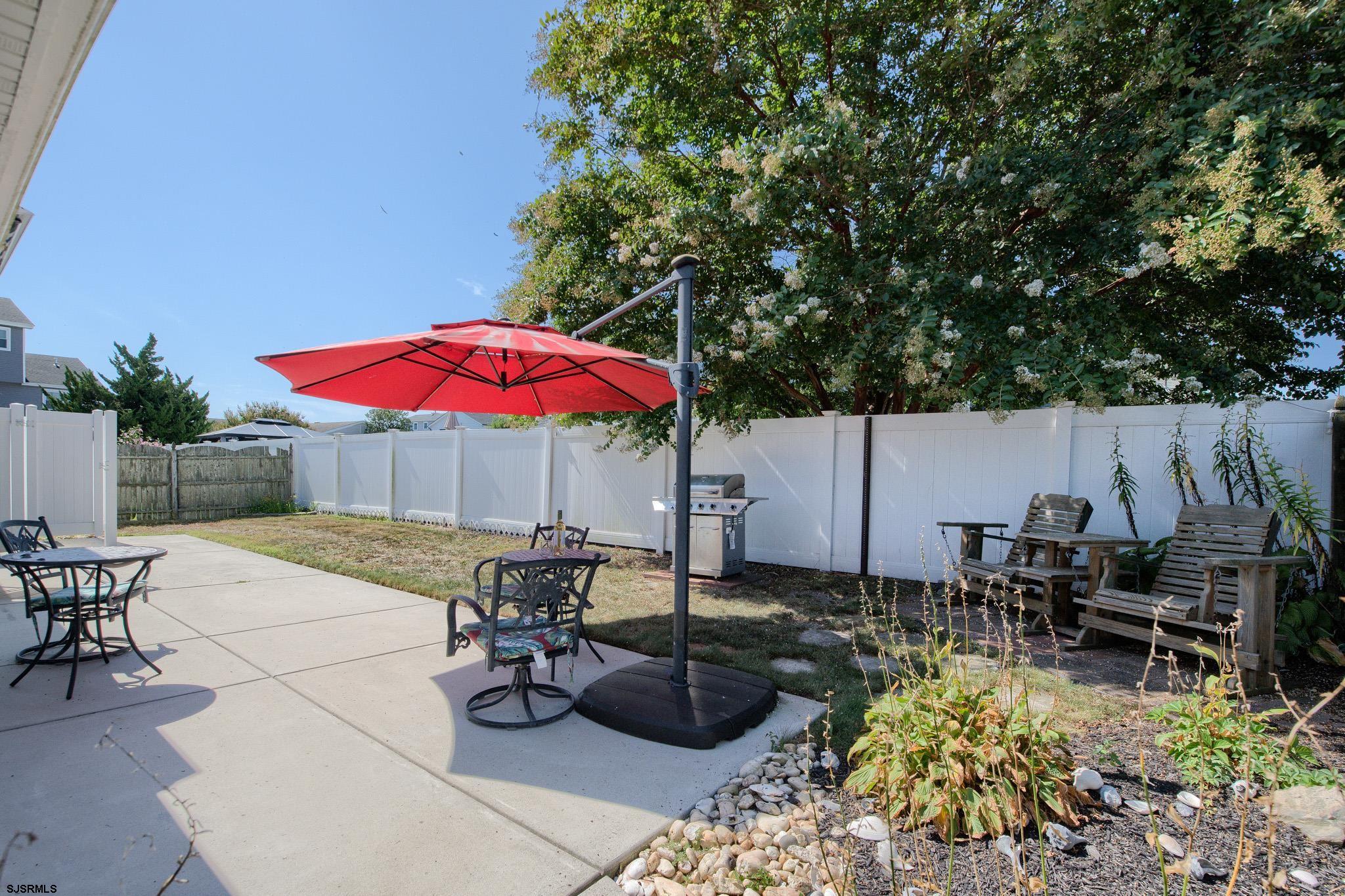 2 Surf Lane Brigantine, NJ 08203 - Photo 30 of 42 a view of backyard with seating space and wooden fence