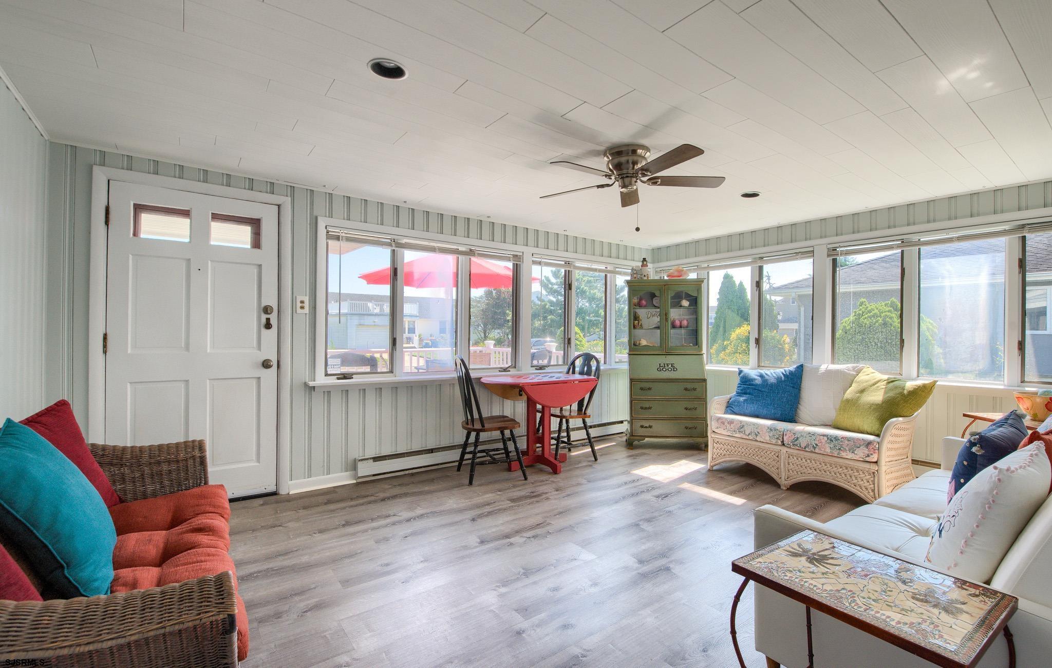 2 Surf Lane Brigantine, NJ 08203 - Photo 5 of 42 a living room with furniture and a large window
