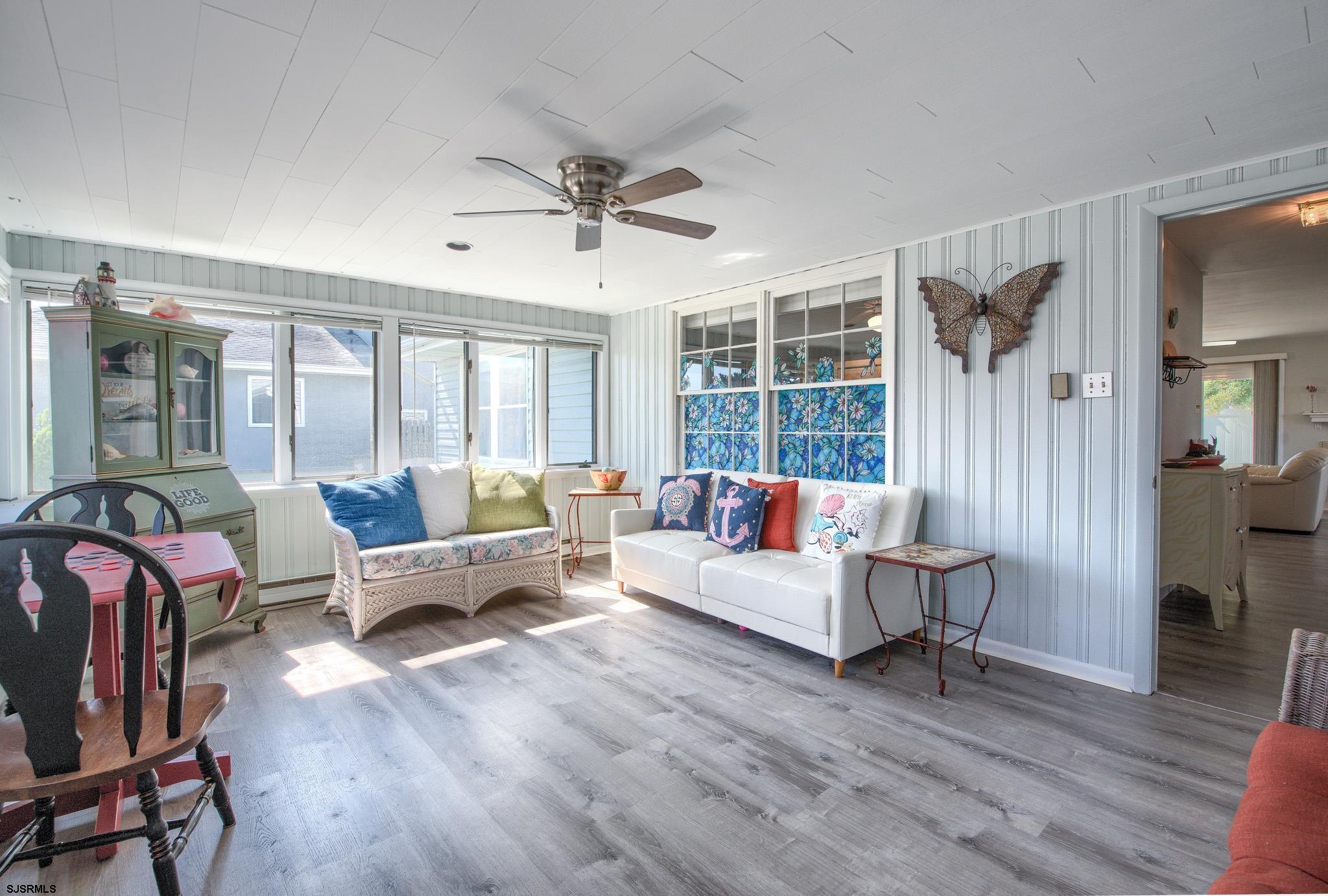 2 Surf Lane Brigantine, NJ 08203 - Photo 6 of 42 a living room with furniture and wooden floor