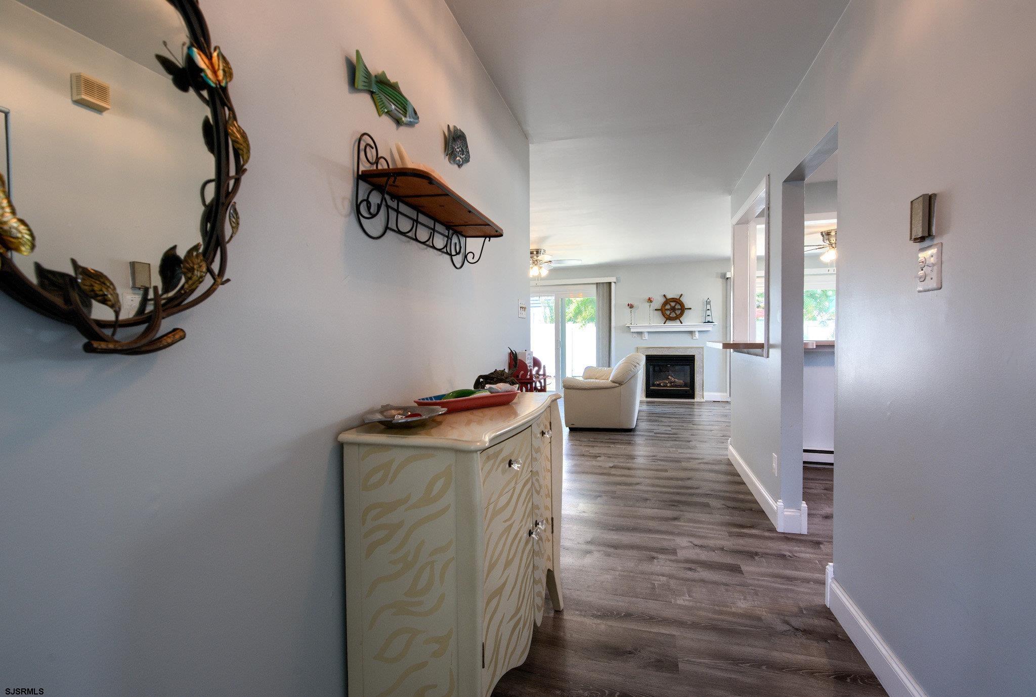 2 Surf Lane Brigantine, NJ 08203 - Photo 7 of 42 a view of a kitchen center island and wooden floor