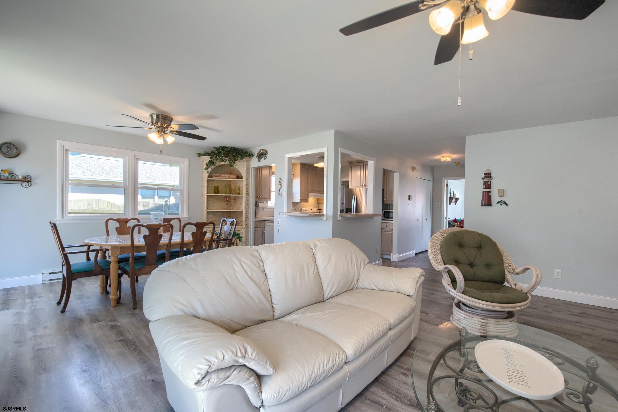 2 Surf Lane Brigantine, NJ 08203 - Photo 10 of 42 a living room with furniture potted plant and a window