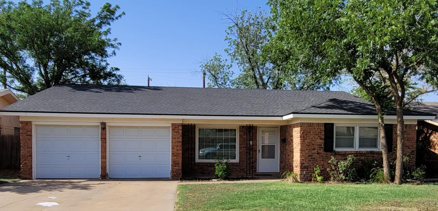 5430 13th Street Lubbock, TX 79416 - Photo 1 of 26 front view of a house with a garden