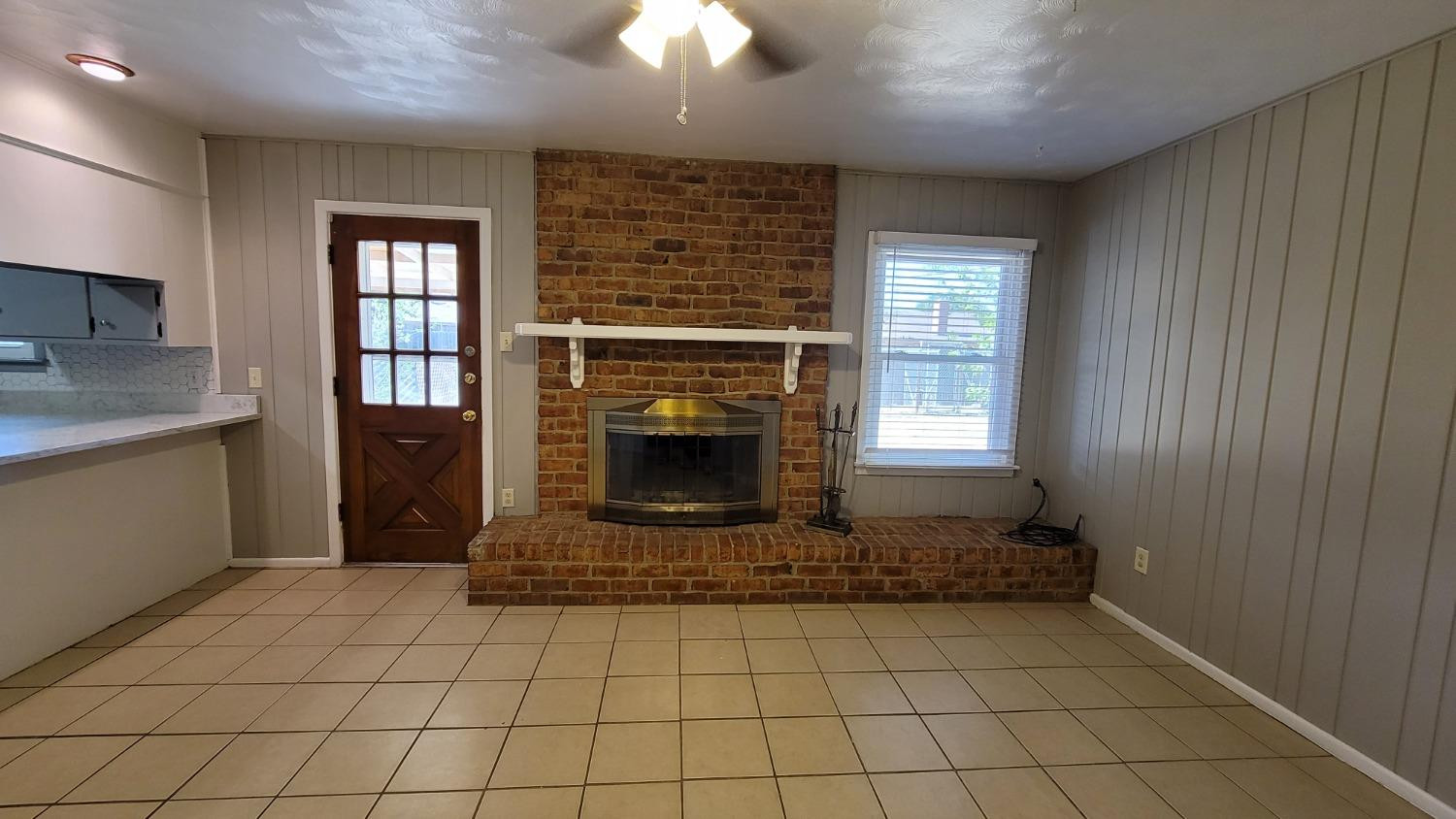 5430 13th Street Lubbock, TX 79416 - Photo 16 of 26 a living room with a fireplace