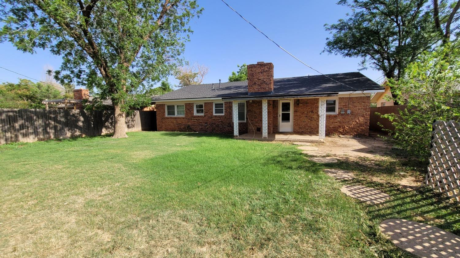 5430 13th Street Lubbock, TX 79416 - Photo 25 of 26 a view of a house with yard and tree s