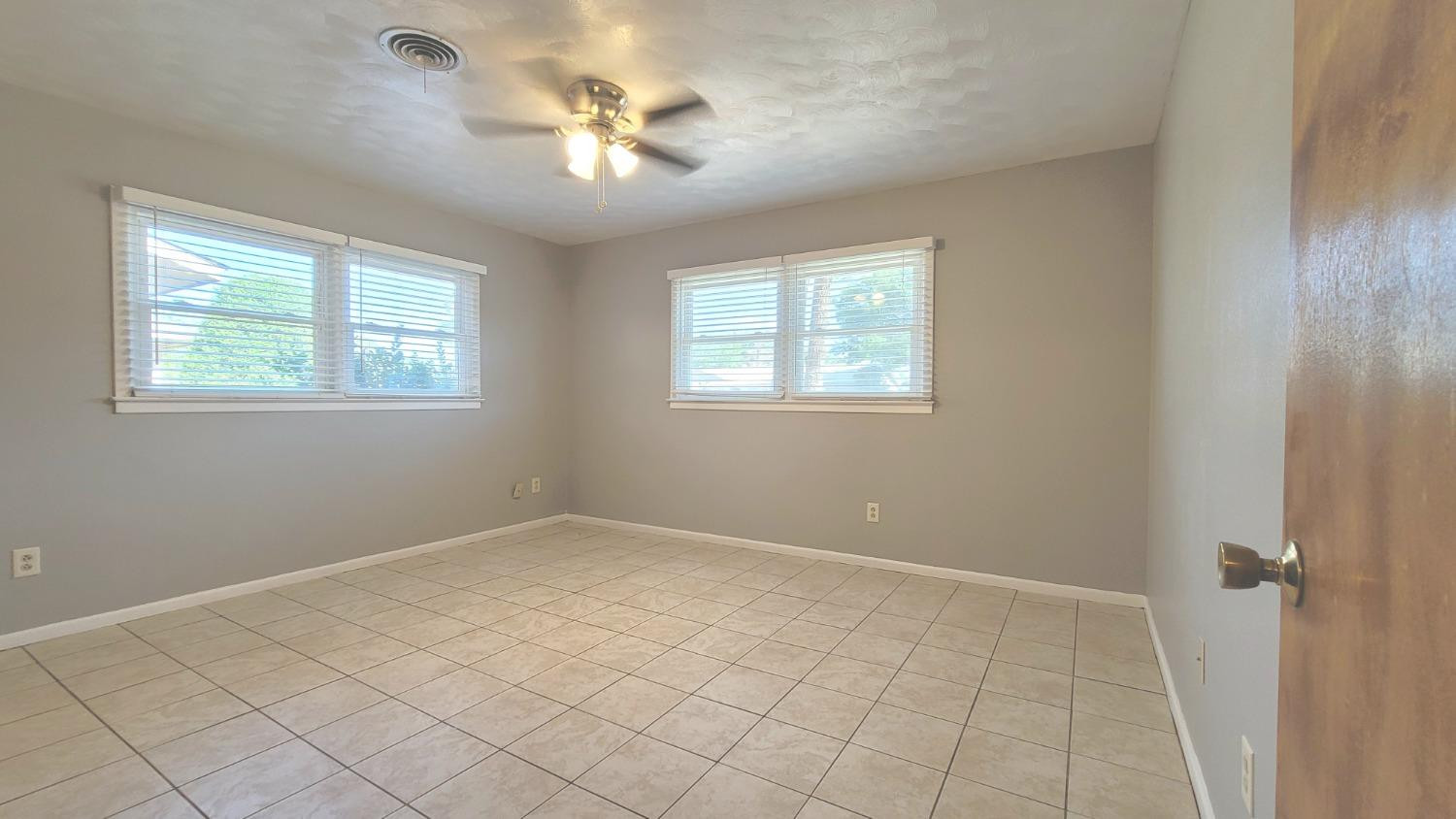 5430 13th Street Lubbock, TX 79416 - Photo 5 of 26 a view of an empty room with a window