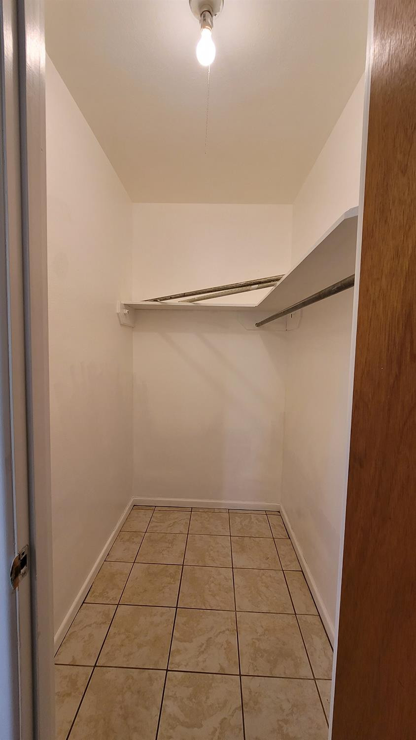 5430 13th Street Lubbock, TX 79416 - Photo 9 of 26 a view of a room with an empty space and a window