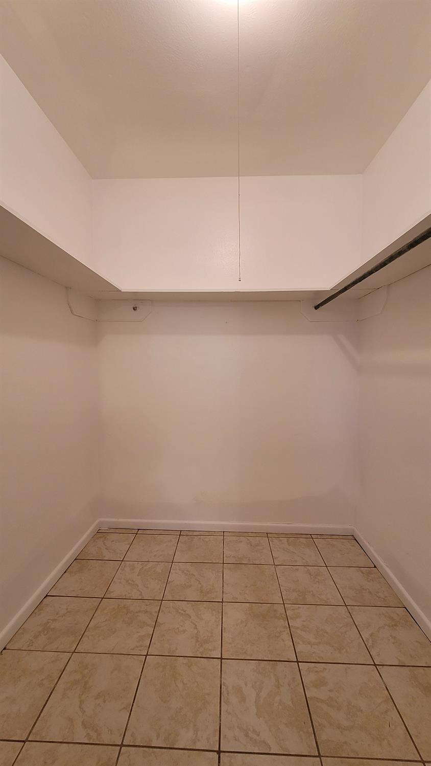 5430 13th Street Lubbock, TX 79416 - Photo 10 of 26 a view of a room with an empty space and a window