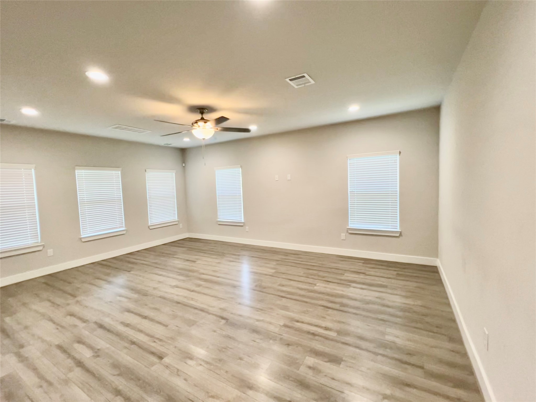 4301 Clover Street Houston, TX 77051 - Photo 12 of 31 wooden floor in an empty room with a window