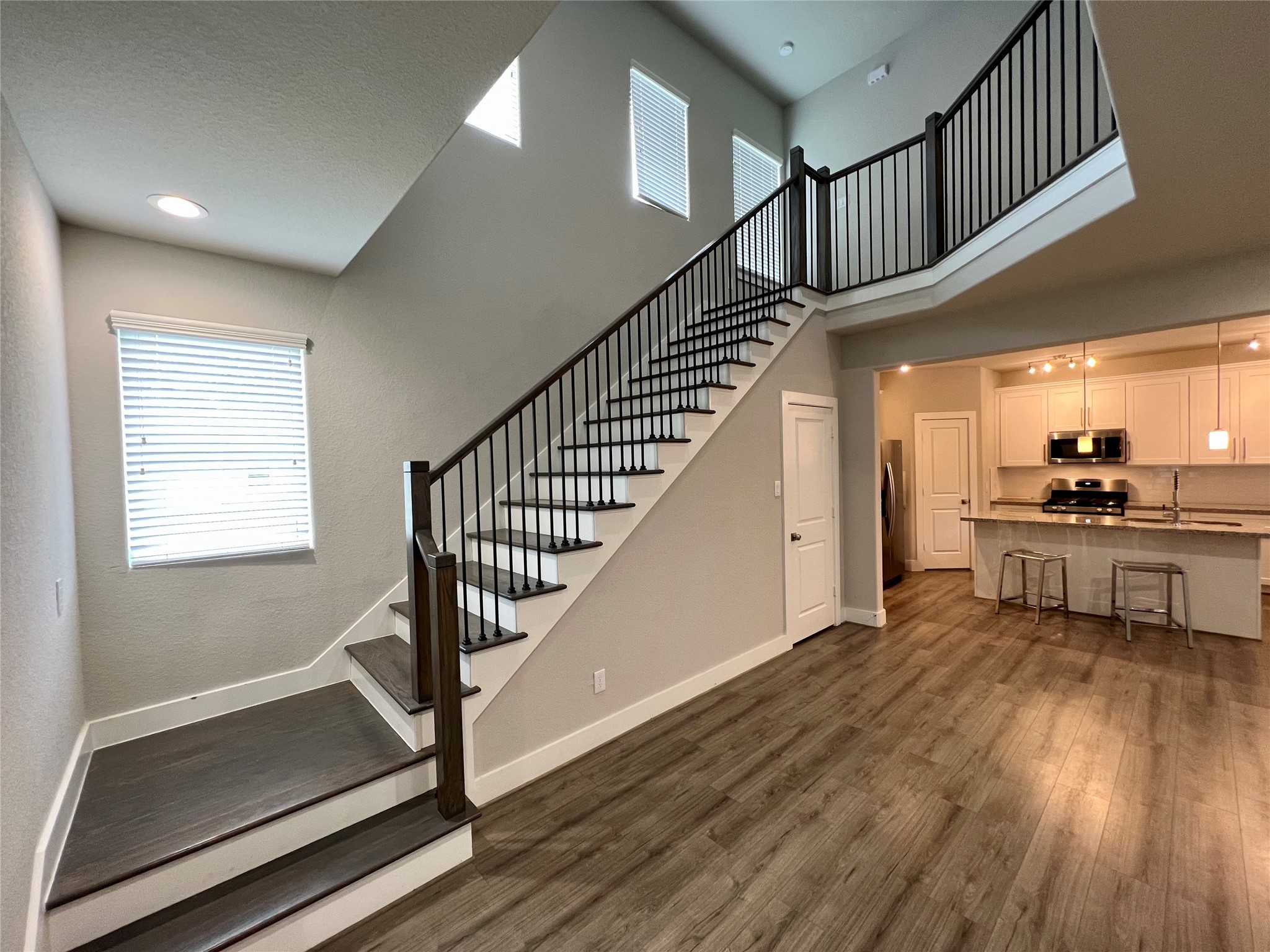 4301 Clover Street Houston, TX 77051 - Photo 14 of 32 a view of front door with hallway and wooden floor