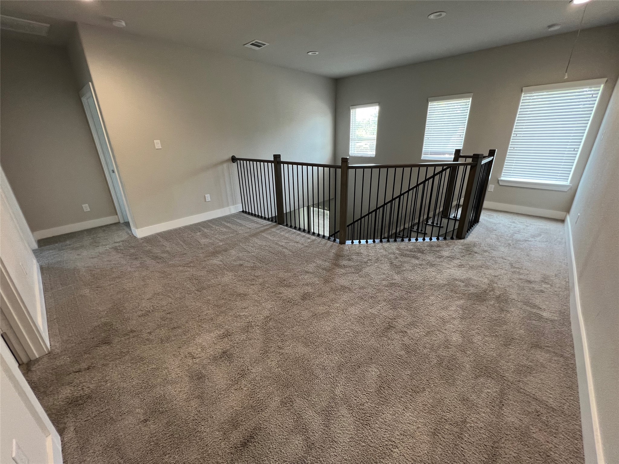 4301 Clover Street Houston, TX 77051 - Photo 15 of 31 a view of staircase with railing and white walls