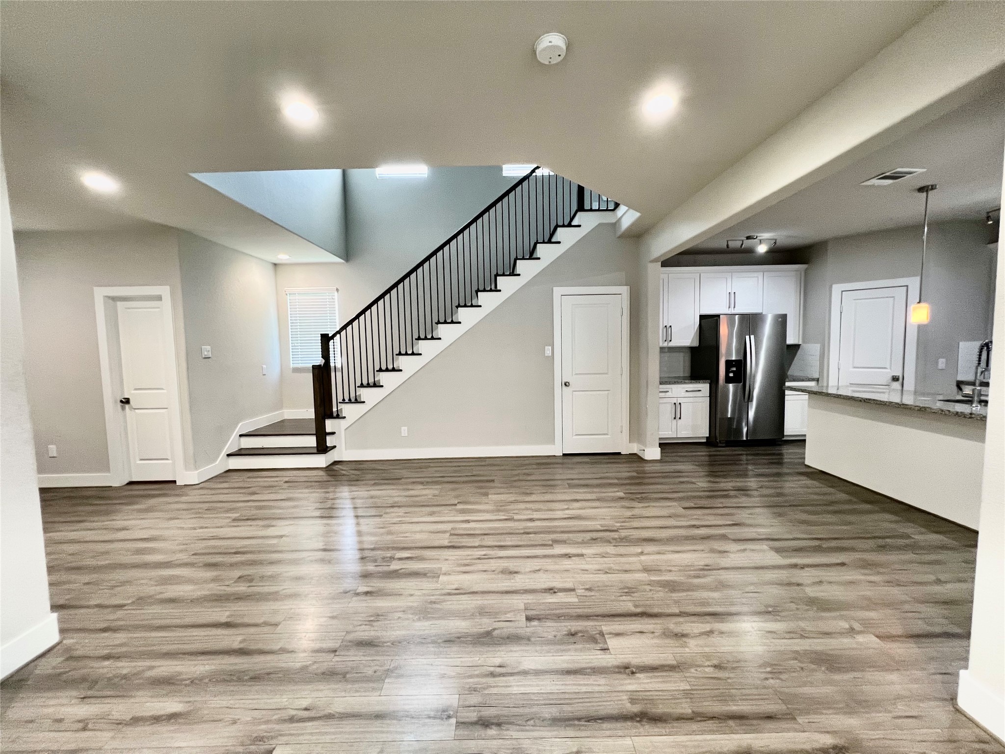 4301 Clover Street Houston, TX 77051 - Photo 8 of 32 a view of a room with wooden floor and stairs