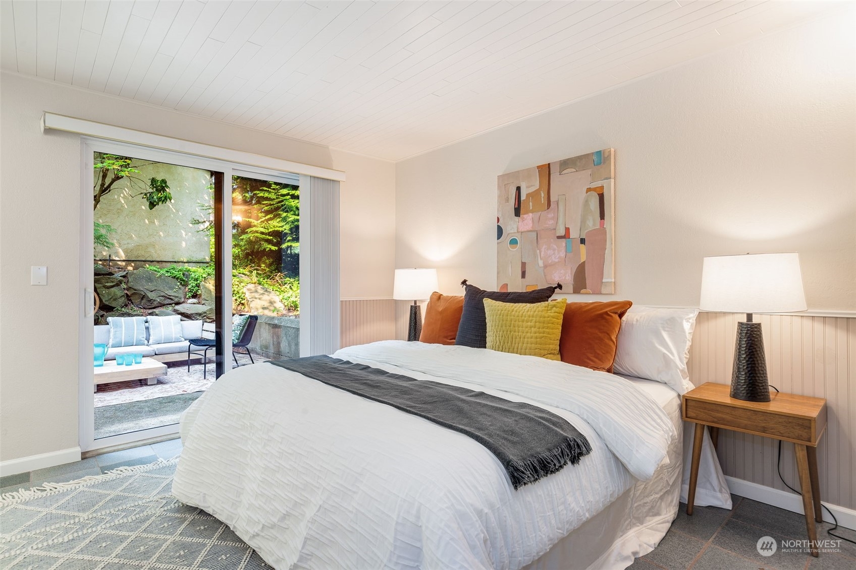 8520 242nd Street Southwest, Unit 101 Edmonds, WA 98026 - Photo 16 of 36 a bed room with a bed and a night stand
