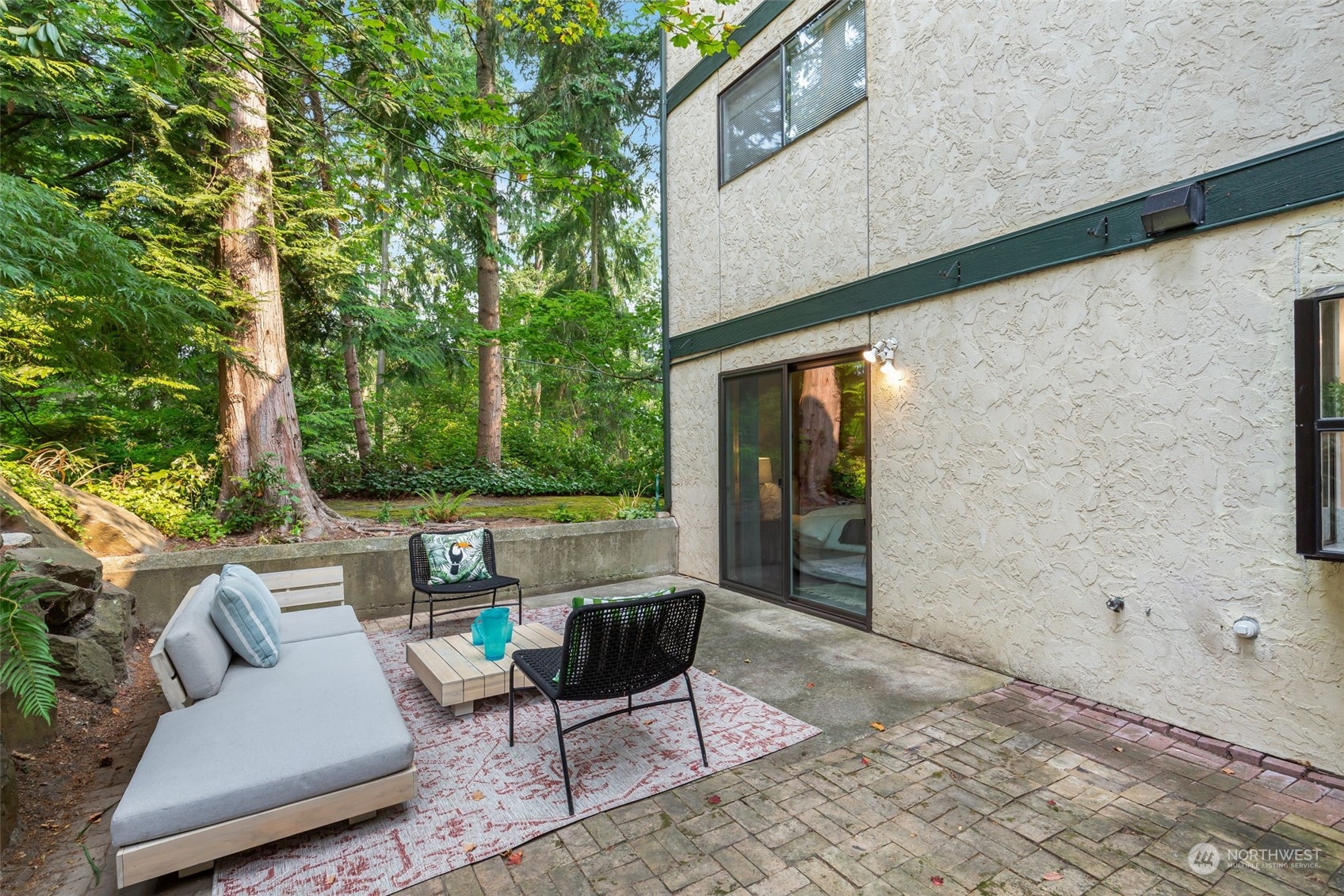 8520 242nd Street Southwest, Unit 101 Edmonds, WA 98026 - Photo 18 of 36 a outdoor living space with furniture and a potted plant