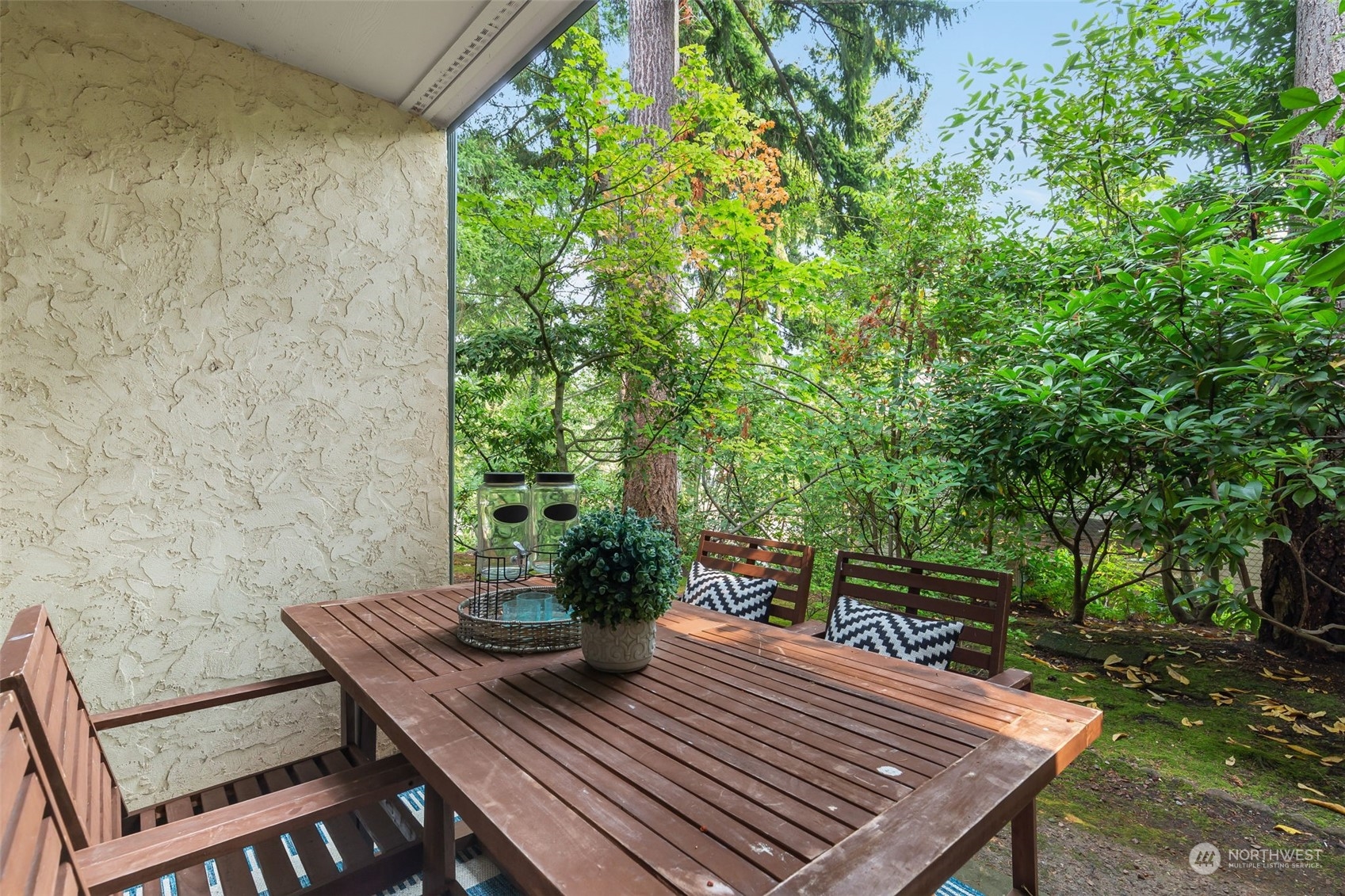 8520 242nd Street Southwest, Unit 101 Edmonds, WA 98026 - Photo 4 of 36 a view of a backyard with sitting area