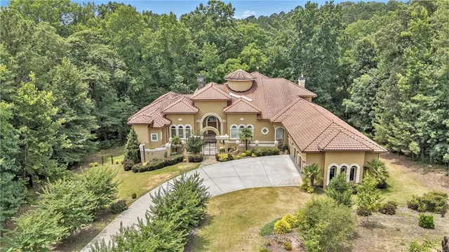 a aerial view of a house with a yard
