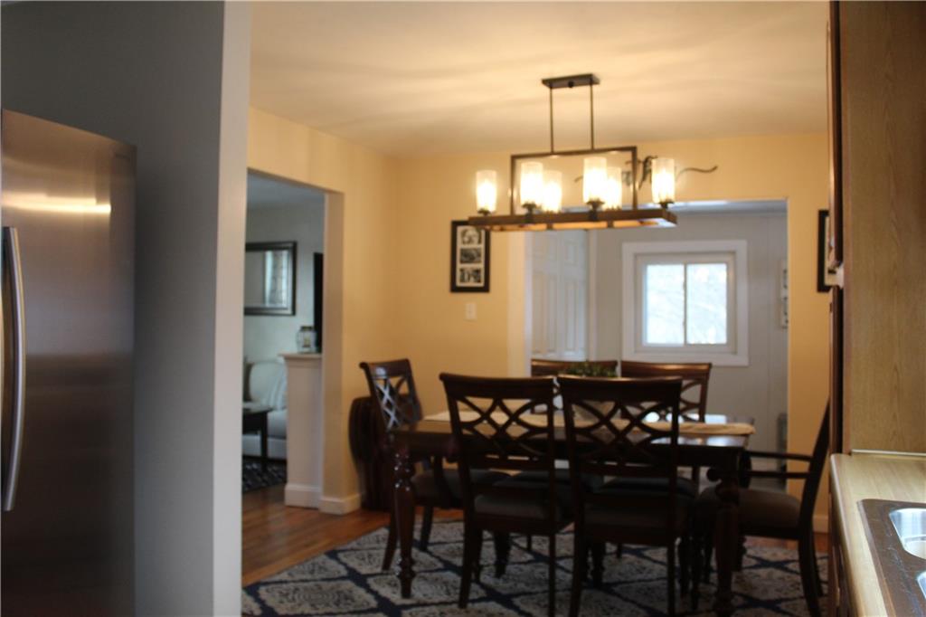 244 Rider Church Road Butler, PA 16001 - Photo 5 of 17 a dining room with a table chairs and a chandelier
