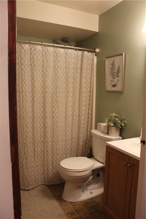 244 Rider Church Road Butler, PA 16001 - Photo 7 of 17 a bathroom with a toilet a sink and a shower