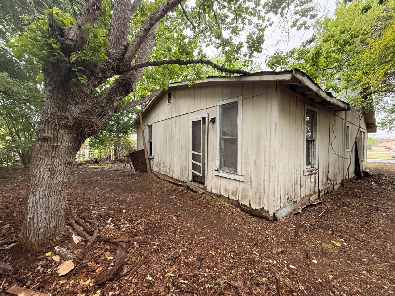 918 Brazos Street Lockhart, TX 78644 - Photo 11 of 14 a small barn with a outdoor space