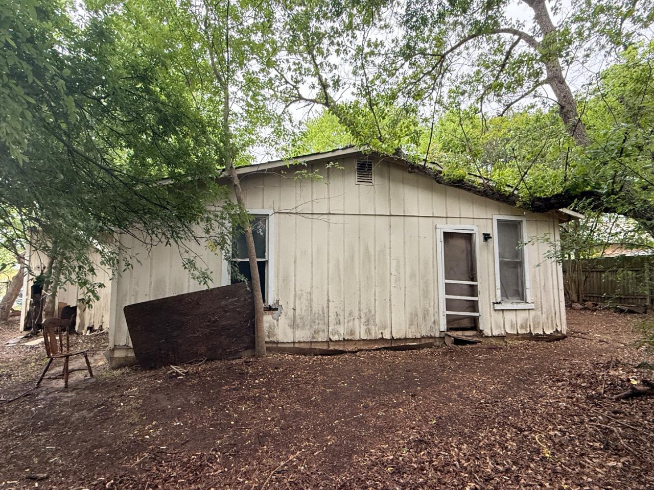 918 Brazos Street Lockhart, TX 78644 - Photo 14 of 14 a view of backyard of house with wooden fence