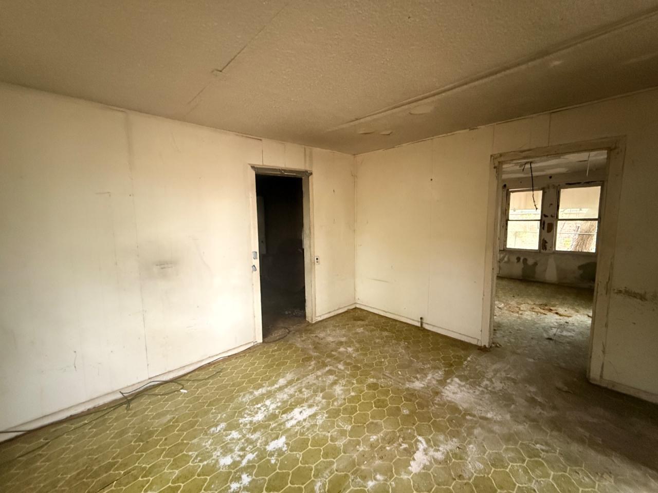 918 Brazos Street Lockhart, TX 78644 - Photo 4 of 14 an empty room with a natural light