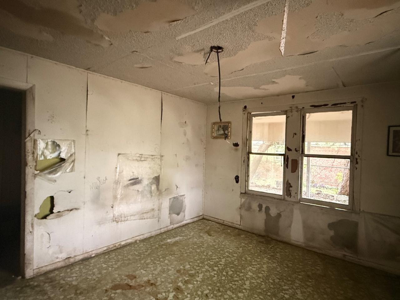 918 Brazos Street Lockhart, TX 78644 - Photo 5 of 14 a view of an empty room with a window