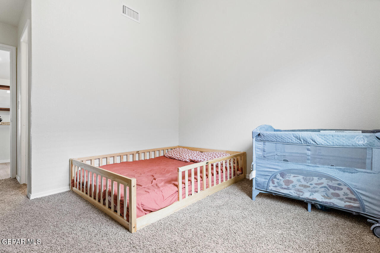 11288 Santa Barbara Socorro, TX 79927 - Photo 20 of 31 a bedroom with a bed and a dresser