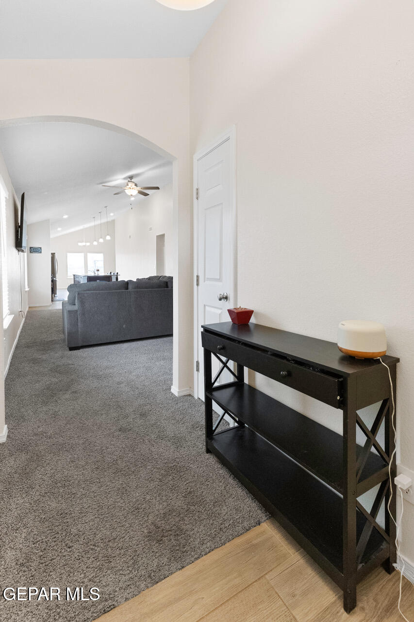 11288 Santa Barbara Socorro, TX 79927 - Photo 2 of 31 a living room with furniture and a wooden floor