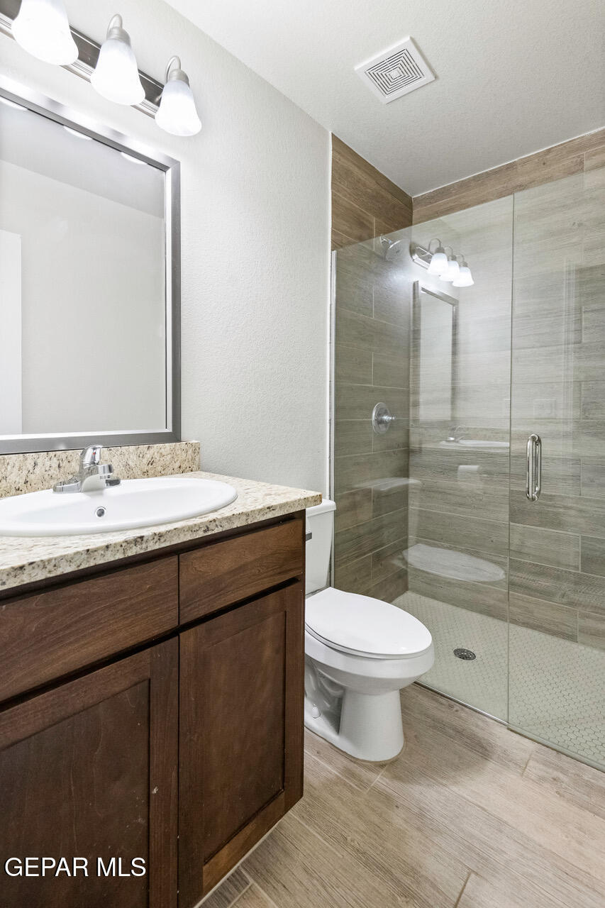 11288 Santa Barbara Socorro, TX 79927 - Photo 21 of 31 a bathroom with a sink toilet and shower