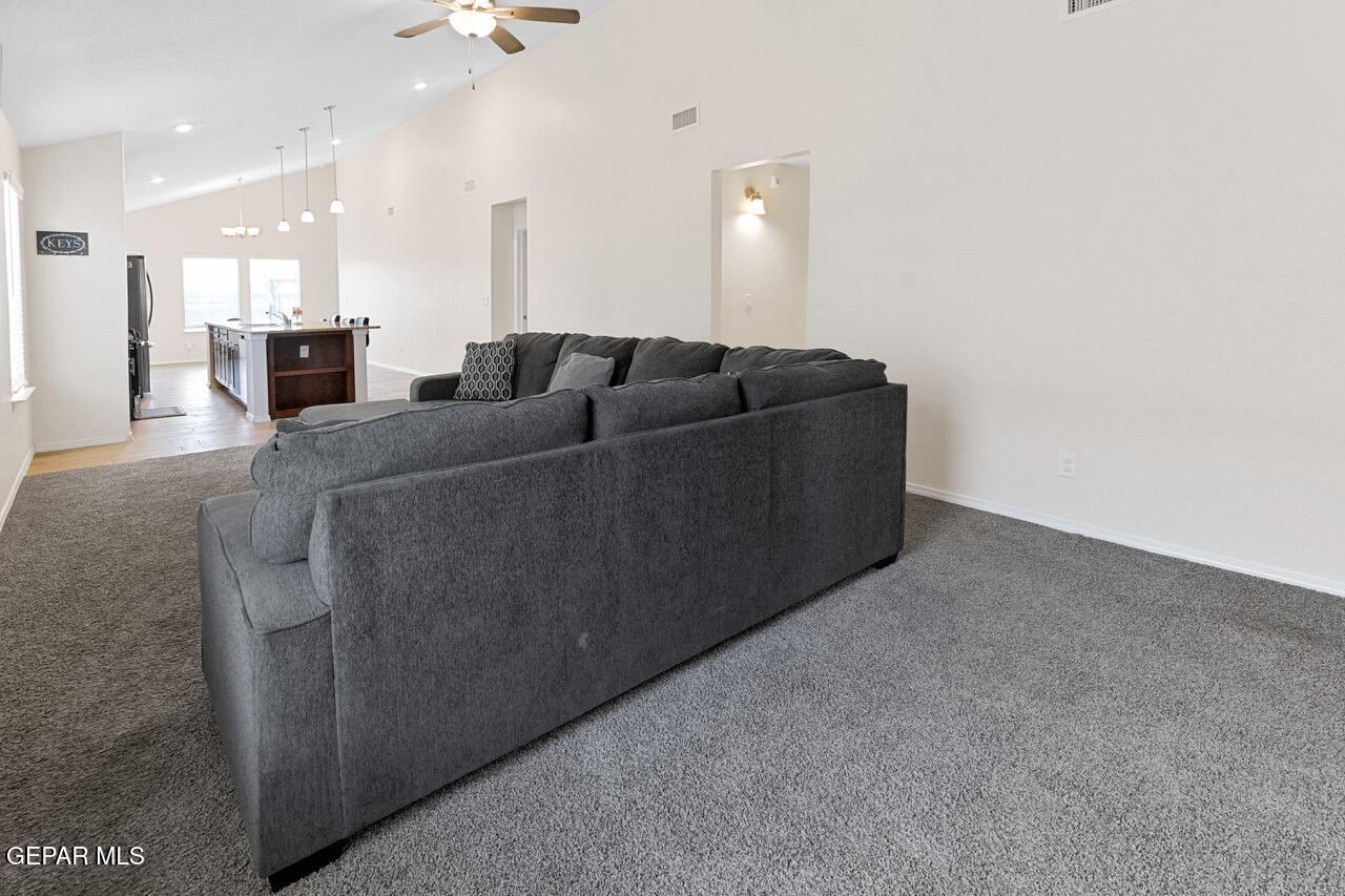 11288 Santa Barbara Socorro, TX 79927 - Photo 4 of 31 a living room with furniture and a mirror
