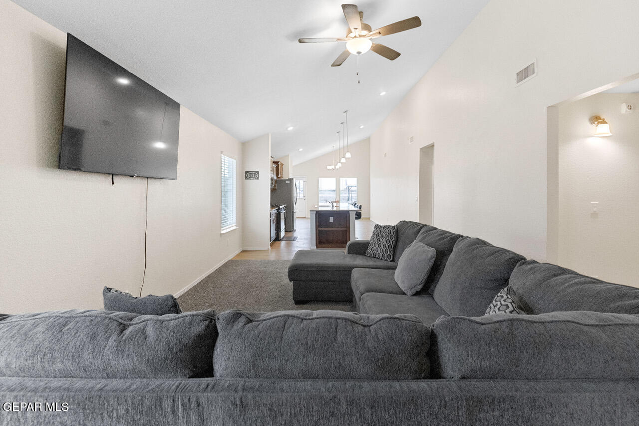 11288 Santa Barbara Socorro, TX 79927 - Photo 5 of 31 a living room with furniture and a flat screen tv