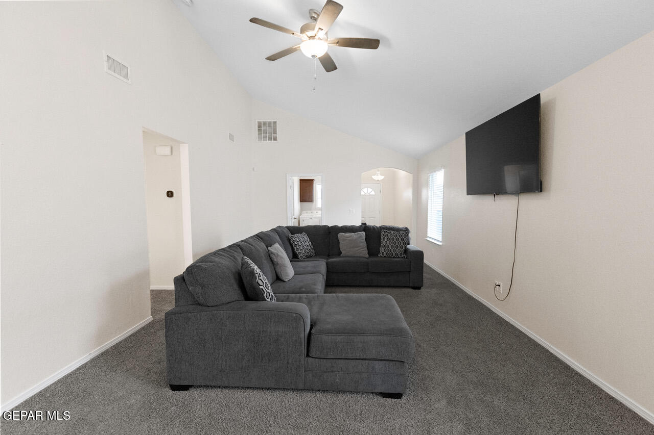 11288 Santa Barbara Socorro, TX 79927 - Photo 6 of 31 a living room with furniture and a flat screen tv