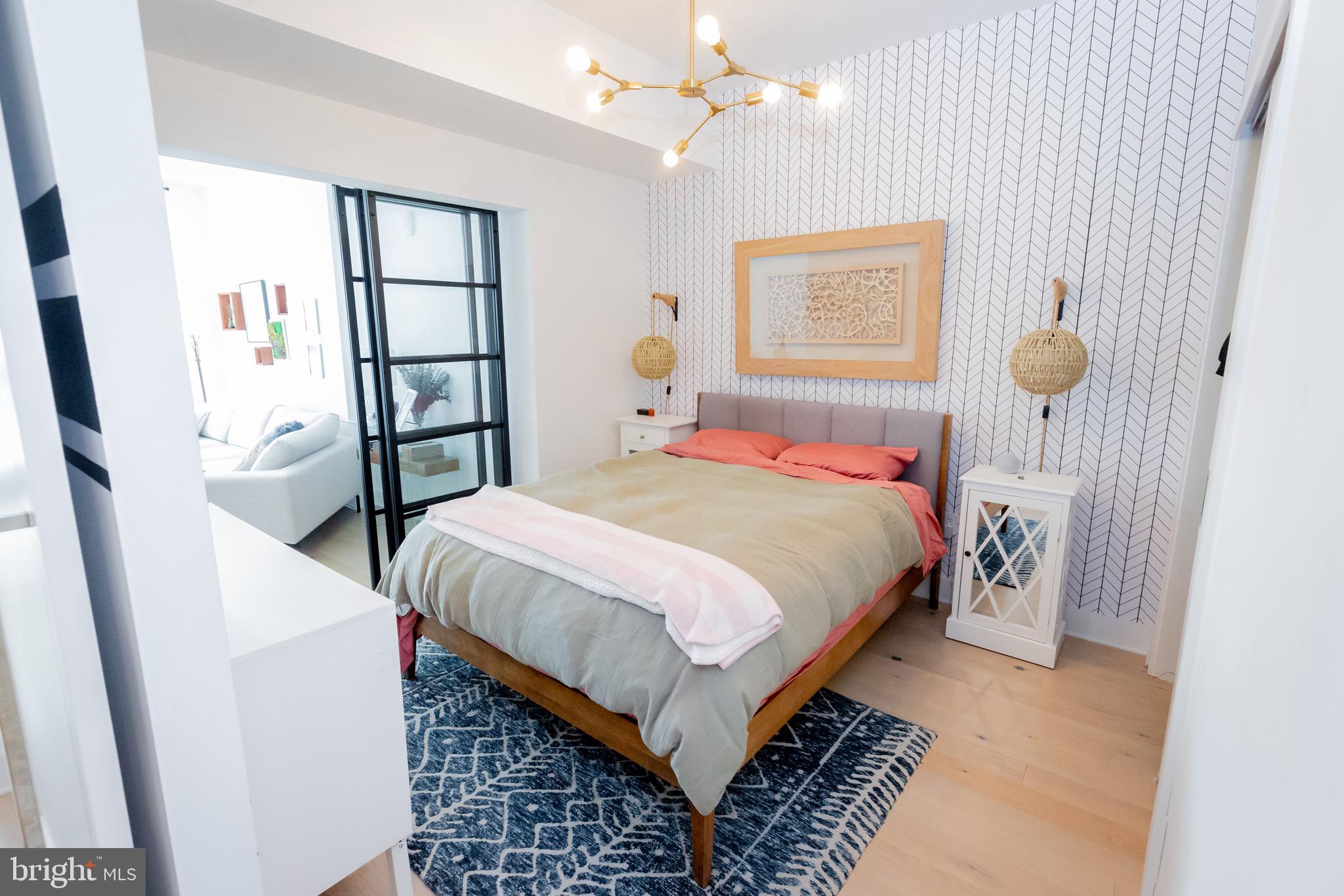 1211 Van Street Southeast, Unit 1210 Washington, DC 20003 - Photo 1 of 42 a bedroom with a bed and a window