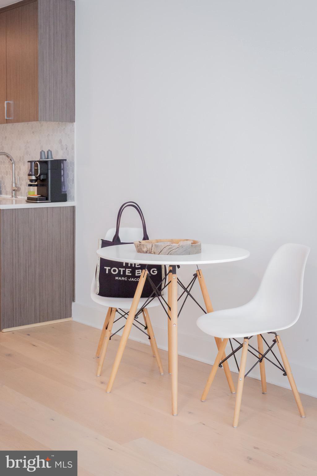1211 Van Street Southeast, Unit 1210 Washington, DC 20003 - Photo 20 of 42 a workspace with a table chair and entryway