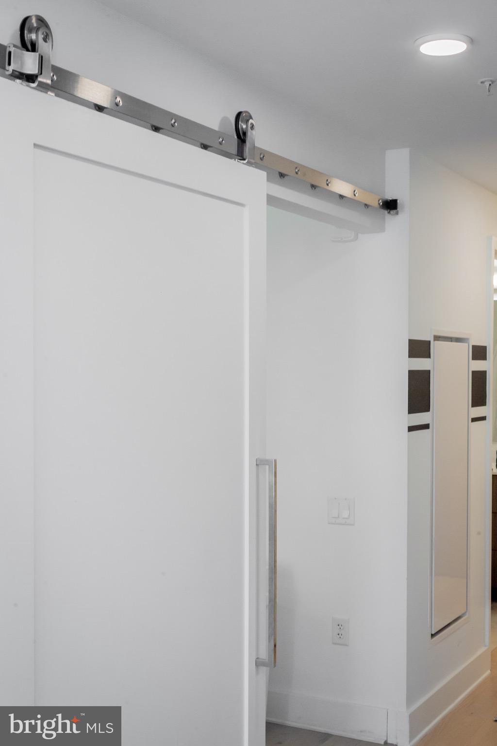 1211 Van Street Southeast, Unit 1210 Washington, DC 20003 - Photo 22 of 42 a view of a room with racks on the wall