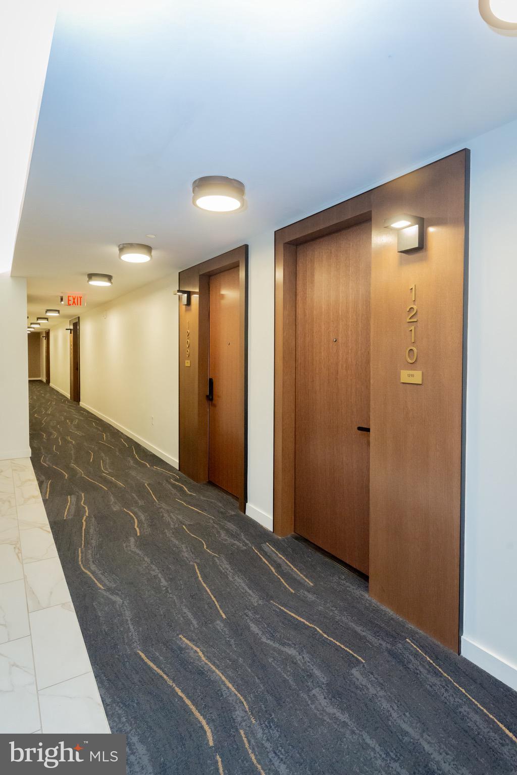 1211 Van Street Southeast, Unit 1210 Washington, DC 20003 - Photo 26 of 42 a view of a hallway with wooden floor