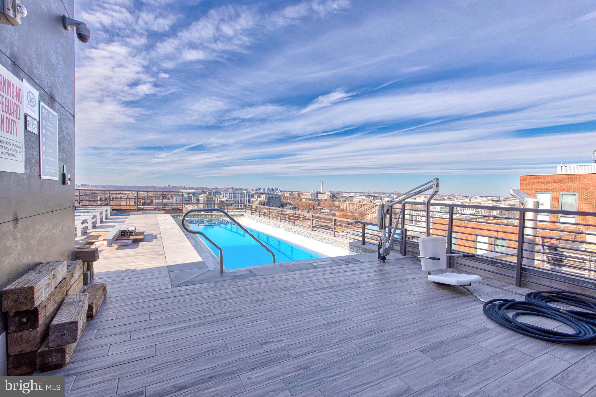 1211 Van Street Southeast, Unit 1210 Washington, DC 20003 - Photo 30 of 42 a view of a swimming pool with lounge chair