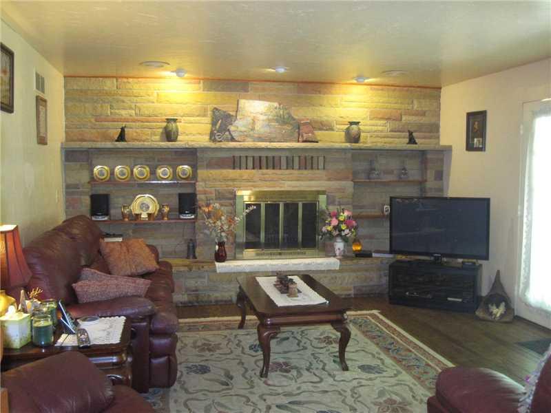 1553 Buffenmeyer Road Latrobe, PA 15650 - Photo 7 of 25 Family Room. 14x17 Family room off kitchen with beautiful hardwood floors, French doors to back patio and a log burning fireplace.